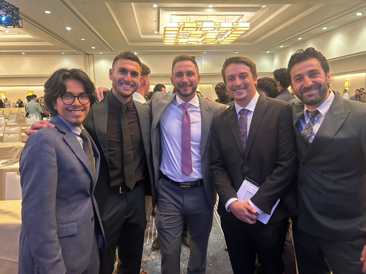 Greywolf Solutions team members networking at professional conference